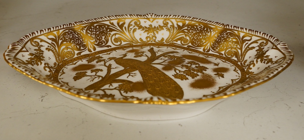 A Crown Derby gold Aves dessert dish with raised design, 28cm wide. Condition - fair to good, some wear to surface